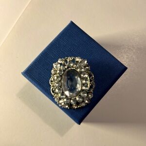 Vintage Brooch silver with faux diamond accents. 1 1/2” long by 1” wide.